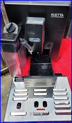 Coffee machine with milk frother and grinder